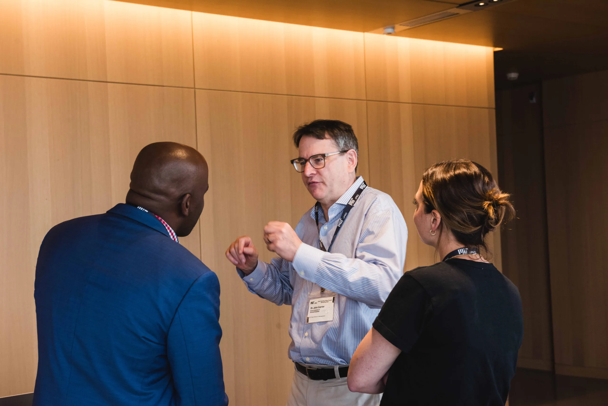 Faculty director David Niño in conversation with participants during a networking event