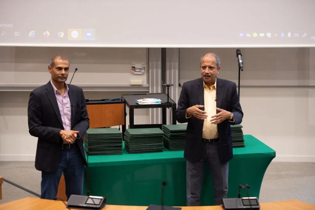 Professors interacting with participants during an on-campus session